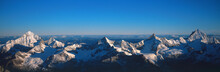 Panoramic Of High Mountain Peaks In The Alps.