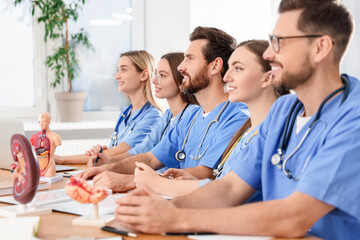 Sticker - Medical students in uniforms studying at university