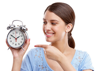 Clock, time and pointing with a model woman in studio isolated on a white background for alarm or reminder. Alarm clock, point and schedule with a young female on blank space for a deadline