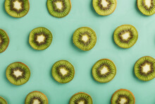 The Patterns Of The Slices Of Kiwi Fruit On Green Background As A Continuous Background.