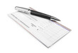 © BillionPhotos.com - Finance checkbook with vintage pen