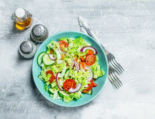 Sticker - Vegetable salad. Salad of cucumbers, tomatoes and red onions with spices and olive oil.