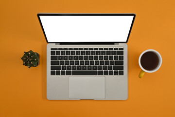 Poster - Top view with Copy space on Yellow background, Empty screen of laptop, coffee cup and cactus, Mock up.