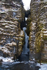 Wall Mural - kvernufoss waterfall in the mountains