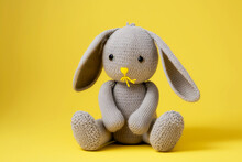 Gray Bunny With Lowered Ears On Yellow Background Cute Kids Knitted Toys
