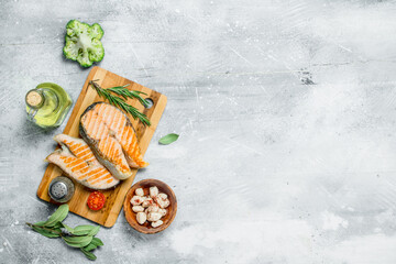 Canvas Print - Grilled salmon steaks with pickled garlic and herbs.