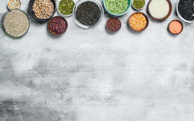 Poster - Organic food. Assortment of legumes in bowls .