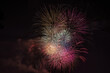 © Austockphoto - Fireworks colours explode in dark night sky