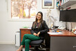 © Austockphoto - portrait of female doctor in her medical office looking at camera smiling
