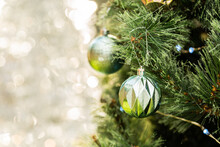Christmas Bokeh Copy Space Beside Green Bauble On Tree