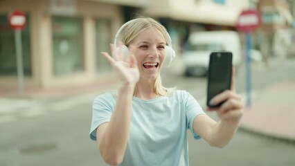 Sticker - Young blonde woman smiling confident having video call at street