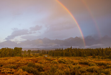  Storm Clouds and Rainbow over the Tetons in Autumn