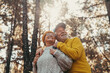 © Daniel - Head shot portrait close up of middle age cheerful people smiling and looking at the the trees of the forest around them. Active couple of old seniors hiking and walking together in the mountain