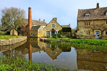 Wall Mural - Cotswolds village of Lower Slaughter with beautiful morning reflections and old mill, England