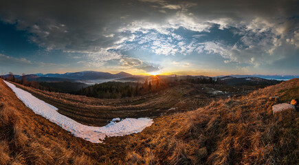 Wall Mural - early morning spring carpathian mountains plateau landscape with snow-covered ridge tops in far, ukr