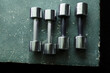 © Cavan Images - Overhead view of dumbbells on table in gym
