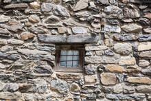 Small Window In A Stone Wall Of An Old House In The Hamlet Of Valfroide, Hautes-Alpes, France.
