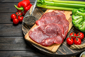 Healthy food. Raw beef meat with organic food assortment .