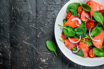 Poster - Fish salad. Salad with slices of salmon, tomatoes and spinach with lime juice.