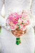 bride holding bouquet of roses flowers