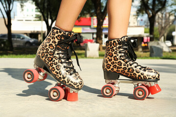 Canvas Print - Woman in stylish roller skates outdoors, closeup