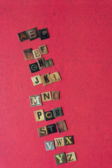 Poster - letters of the alphabet composed from chipboard tiles displaying vintage style letters