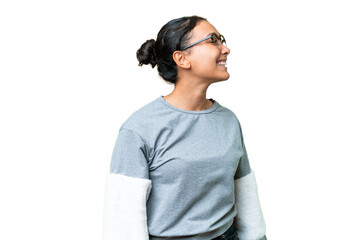 Wall Mural - Young Uruguayan woman over isolated chroma key background laughing in lateral position