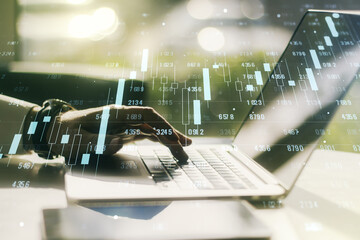Fototapete - Abstract creative stats data concept with hands typing on laptop on background. Multiexposure