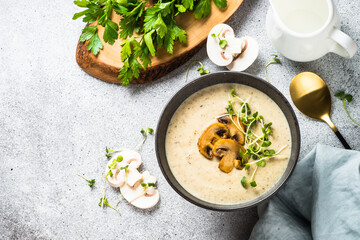 Wall Mural - Mushroom Soup on light stone table. Champignon cream soup. Top view with copy space.