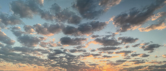 Cloudscape skyline. Panorama of cloudy sunset sky background