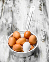 Eggs in a saucepan.