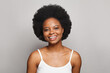 © millaf (Nemchinova) - Pretty smiling woman looking at camera on white studio wall background