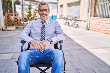 Sticker - Middle age hispanic man wearing business clothes sitting on wheelchair at street