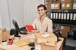 © Krakenimages.com - Young caucasian man ecommerce business worker using touchpad at office