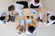 © alotofpeople - Diverse business team at meeting