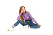 © Asier - Young redhead woman sitting isolated cut out