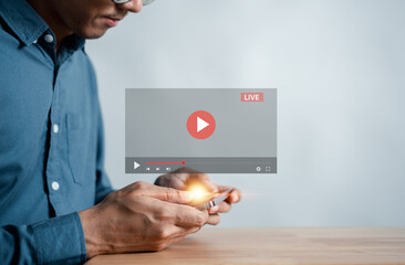 Man touching smartphone to starting live streaming and watching screen for video streaming on internet and multimedia, social technology, social Media, lifestyle with technology...