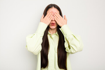 Wall Mural - Young caucasian woman isolated on white background afraid covering eyes with hands.