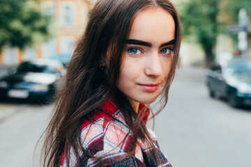 Portrait of young woman in city