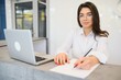 © Serhii - Portrait of receptionist at desk in lobby