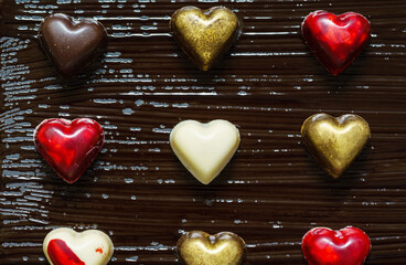 Wall Mural - chocolate hearts on the dark background