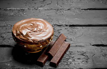 Chocolate paste in bowl .