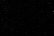 © Kepler - Abstract splashes of rain and snow freeze the movement of white particles on a black background