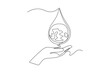 Continuous one line drawing hand catches a drop of earth water. World water day concept. Single line draw design vector graphic illustration.