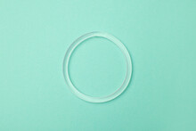 Diaphragm Vaginal Contraceptive Ring On Turquoise Background, Top View