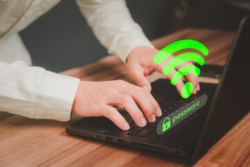 Poster - Man using laptop computer to connect to internet wifi and wait for digital information form website to load. Technology concept of waiting to connect to internet Wi-Fi.