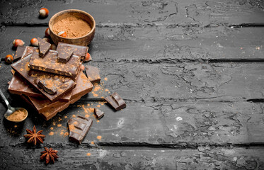 Sticker - Assortment of different types of chocolate with cocoa powder.