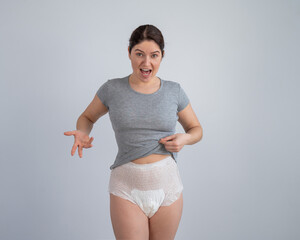 Wall Mural - A woman in adult diapers. Urinary incontinence problem.