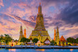 Leinwanddruck Bild - Wat Arun temple Bangkok during sunset in Thailand. Chao praya river