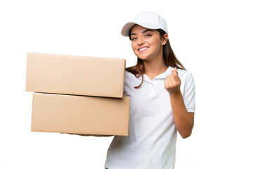 Wall Mural - Delivery caucasian woman holding boxes isolated on green chroma background making money gesture